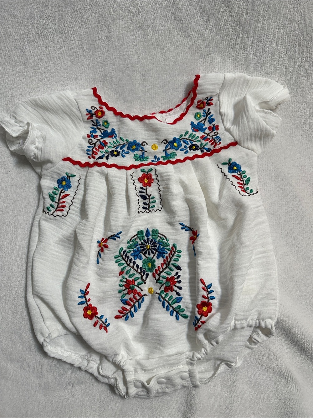 Embroidered White Baby Romper with Multicolor Floral Accents
